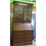 C19th and later mahogany bureau bookcase, two glazed doors and fall front above two short and