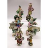 Pair of Chelsea style figures of a lady and gentleman gardener, three other similar figures and a