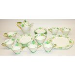 Paragon Art Deco pattern F2156 tea service, painted with flowers and green bands, comprising teapot,