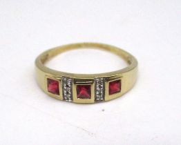 9ct yellow gold ring set with three square cut rubies and milgrain set diamonds, stamped 9k, size W,