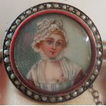 Late C18th yellow metal brooch set with portrait miniature of a young woman, with seed pearl