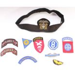 Collection of WWII era US military cloth and bullion patches and badges, including a US Navy