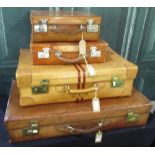 Four leather suitcases, including three with monograms, W76cm D40 H15cm max (4)