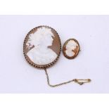 C20th cameo brooch on 9ct yellow gold mount, stamped 9ct, and another smaller cameo brooch on 9ct