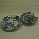 C19th Delft style blue and white barbers bowl, central recessed bowl decorated with flowers and