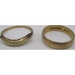 9ct yellow gold band, stamped 375, size P, and a another 9ct gold ring, stamped 375, size Q1/2,