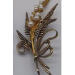 9ct yellow gold brooch by Alabaster and Wilson, in the form of a ribbon tied floral spray, set