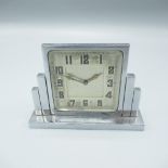 Art Deco period dressing table time piece in stepped chrome plated case, square bevelled glass