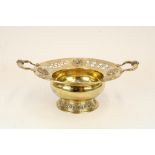 Edw. VII Arts and Crafts hallmarked silver gilt two handled pedestal bowl, decorated throughout in