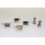 ER.II silver hallmarked six piece matched cruet set with blue glass liners and spoons, London 1960