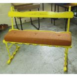 Vintage metal framed cart seat, with wooden seat and back rail, yellow and green painted detail,