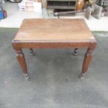 Oak occasional table with carved legs and bun feet