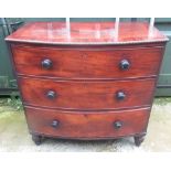 Early Victorian mahogany bow front chest of three drawers, figured and crossbanded top, turned