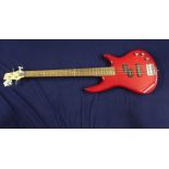 Electric bass guitar with solid body in red finish, with maple neck marked Ibanez on head stock,