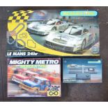 Collection of Scalextric track, Mighty Metro set with cars and a boxed Pacer system. See photos