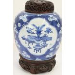 Chinese Kangxi period porcelain jar decorated in underglaze blue with a prunus and cracked ice