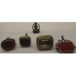 Four Victorian and later seal fobs, two set with coloured stones, one set with intaglio portrait,