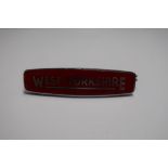 West Yorkshire red enamel cap badge