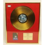 BPI ‘gold’ disc award, presented to Chris Rea to recognise sales in the United Kingdom of more