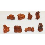 Collection of carved wood netsuke modelled as playful rats (8)