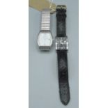 Citizen Eco-Drive wristwatch with date, chrome plated rectangular case, on leather strap and another