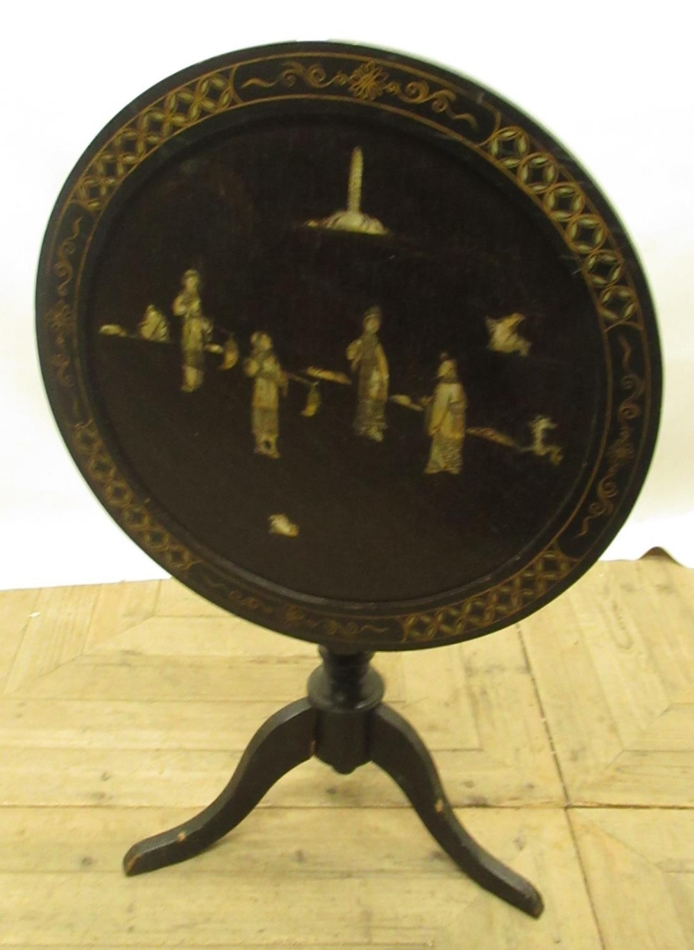 C20th Japanese ebonised snap top tripod table, with mother of pearl inlay and painted gilt