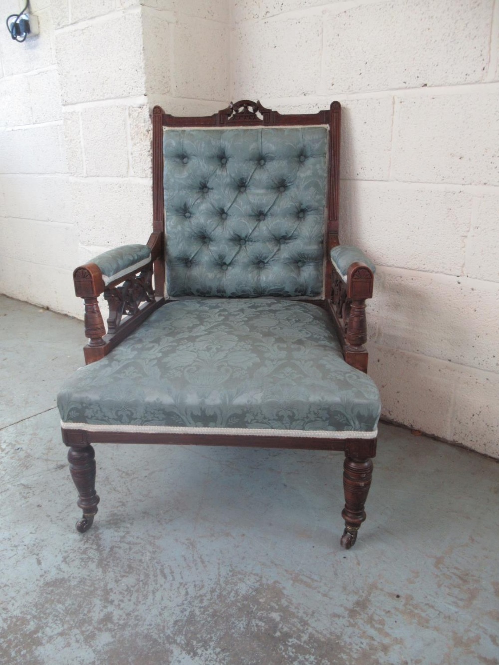 Victorian walnut framed nursing chair, deep buttoned back upholstered in pale blue damask type