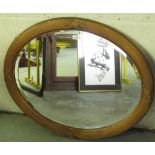 C20th oval bevelled edge wall mirror in reed and ribbon tied gesso frame, W86cm H71cm