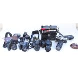 Collection of cameras and camera equipment and accessories to include Canon AE-1 with Vivitar 75-