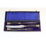 Edw. VII three piece carving set with ebonised stag horn handles and embossed silver ferrules and