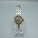Swiss, c20th ladies gold cased wristwatch, silvered and engraved Roman dial, two piece case with