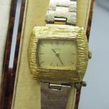 Baume ladies hand wound wristwatch, signed dial with baton hour indices, gold plated bark effect