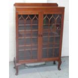 C20th walnut display cabinet, three shelves enclosed by two astragal glazed doors on cabriole