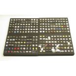 Collection of pairs of modern cufflinks in 4 black foam trays