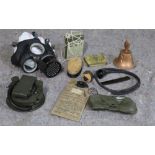 WWII military related items, including gas mask, water purifier, tin containing drinking water