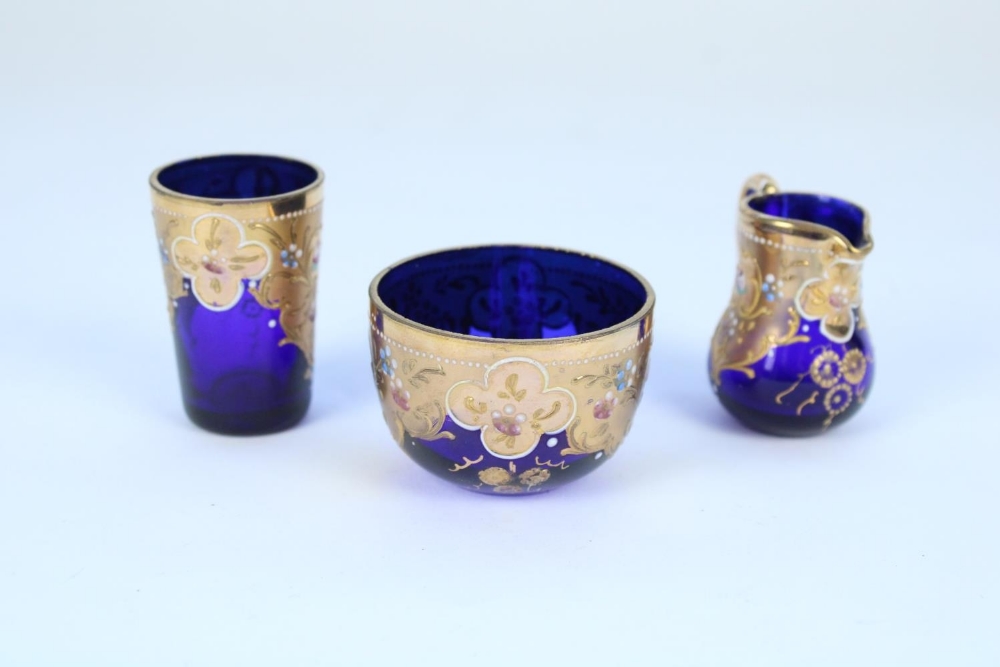 Early C20th Bohemian blue glass and gilt enamel miniature jug, bowl and beaker set in the manner - Image 2 of 2