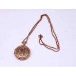 Rose coloured metal circular locket pendant with engraved design, no hallmark, on 9ct rose gold bail