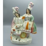 C19th Staffordshire group of highland couple with dog, H32.5cm