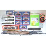 Collection of OO gauge railway wagons and scenic accessories, including Metcalfe models, unmade