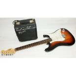 Fender Squier Strat. electric guitar, sunburst finish, and Squier SP.10 230v practice amp, in