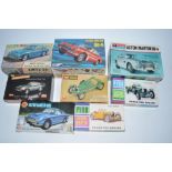 Eight Aston Martin plastic model kits of various scales including unbuilt DB4, Airfix DB6, Airfix
