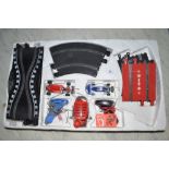 Scalextric set with two cars (both damaged), four hand controllers and selection of track (A/F)
