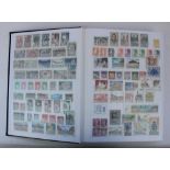Five albums of world and commonwealth stamps, both defins and commems, mainly mid to late C20th