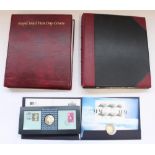 Two albums of FDCs, presentation packs and coin covers