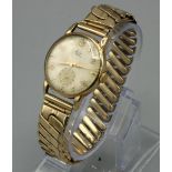 Avia 9ct gold hand wound oval wristwatch, signed champagne dial with applied Arabic and dot indices,