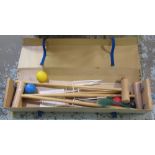 Croquet set in a travelling cardboard/wood case comprising 4 mallets, 4 balls, etc.