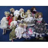 Large collection of modern porcelain collector's dolls in various outfits