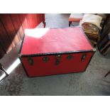 Large red trunk containing various clothing incl. Hunting jacket with gilt buttons, Devlin & Co.