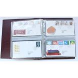 Collection of FDCs in four Royal Mail First Day Cover burgundy folders