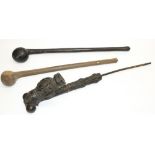 African (Cameroon): cast metal figural tribal ceremonial pipe, L54cm, and two knobkerries/clubs,